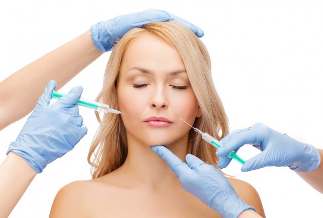 photodune-7064054-woman-face-and-beautician-hands-with-syringes-m-46310-636x0